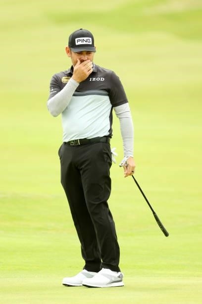 Louis Oosthuizen of South Africa reacts after missing a put on the seventh hole during Day One of The 149th Open at Royal St George’s Golf Club on...