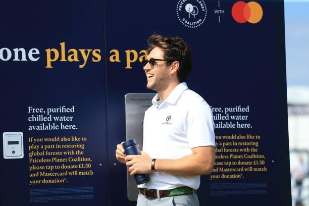 Niall Horan smiles as he is interviewed on event sustainability during Day One of The 149th Open at Royal St George’s Golf Club on July 15, 2021 in...
