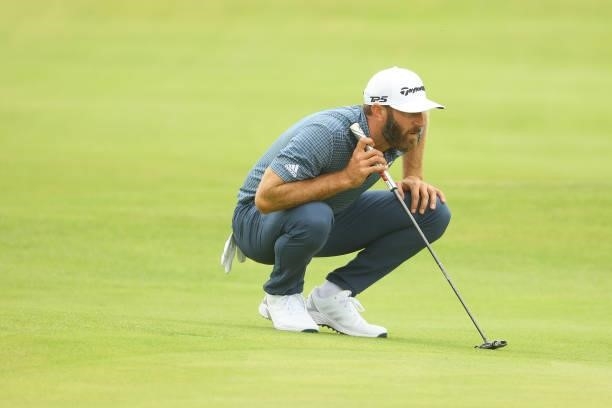 Dustin Johnson of the United States lines up a shot on the green of the seventh hole during Day One of The 149th Open at Royal St George’s Golf Club...