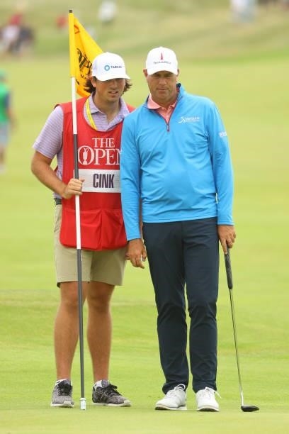 Stewart Cink of the United States and his caddie, Reagan Cink look on from the seventh hole during Day One of The 149th Open at Royal St George’s...
