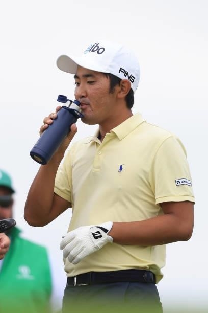 Takumi Kanaya of Japan drinks from a reusable water bottle on the 5th tee during Day One of The 149th Open at Royal St George’s Golf Club on July 15,...