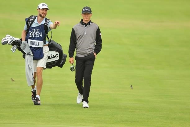 Marcus Kinhult of Sweden and his caddie make their way up the 18th hole during Day One of The 149th Open at Royal St George’s Golf Club on July 15,...