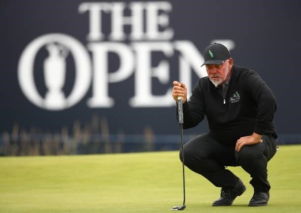 Darren Clarke of Northern Ireland lines up a shot on the 18th hole during Day One of The 149th Open at Royal St George’s Golf Club on July 15, 2021...