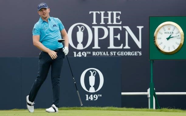Matt Wallace of England watches his shot from the first tee during Day One of The 149th Open at Royal St George’s Golf Club on July 15, 2021 in...