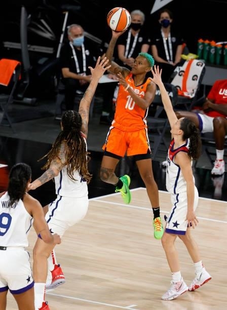 Courtney Williams of Team WNBA shoots against Brittney Griner and Sue Bird of the USA Women's National Team during the 2021 WNBA All-Star Game at...