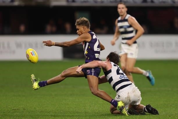 Liam Henry of the Dockers gets tackled by Jed Bews of the Cats during the round 18 AFL match between the Fremantle Dockers and Geelong Cats at Optus...