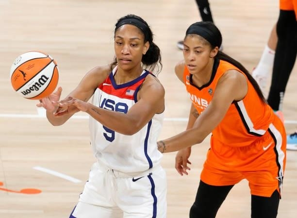 Ja Wilson of the USA Women's National Team is guarded by Candace Parker of Team WNBA during the 2021 WNBA All-Star Game at Michelob ULTRA Arena on...