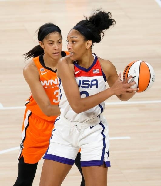 Ja Wilson of the USA Women's National Team is guarded by Candace Parker of Team WNBA during the 2021 WNBA All-Star Game at Michelob ULTRA Arena on...