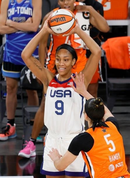 Ja Wilson of the USA Women's National Team is guarded by Dearica Hamby of Team WNBA during the 2021 WNBA All-Star Game at Michelob ULTRA Arena on...