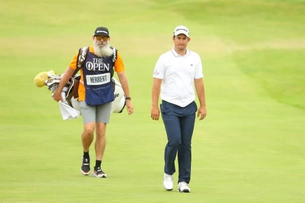 Lucas Herbert of Australia makes his way along the 18th hole with his caddie during Day One of The 149th Open at Royal St George’s Golf Club on July...