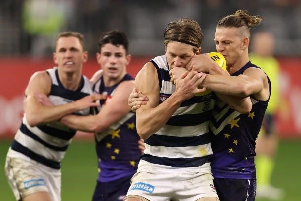 Nat Fyfe of the Dockers tackles Rhys Stanley of the Cats during the round 18 AFL match between the Fremantle Dockers and Geelong Cats at Optus...
