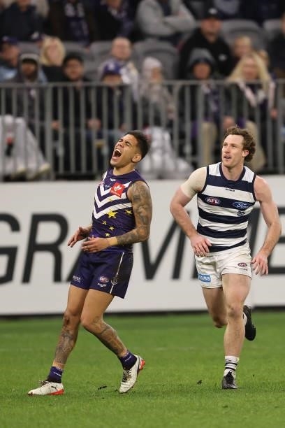 Michael Walters of the Dockers reacts as Patrick Dangerfield of the Cats kicks a goal during the round 18 AFL match between the Fremantle Dockers and...