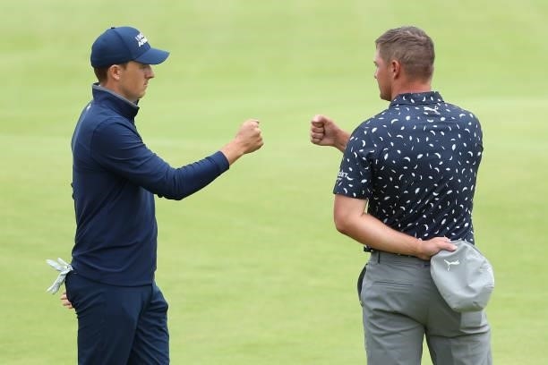 Jordan Speith of United States fist bumps Bryson Dechambeau of The United States during Day One of The 149th Open at Royal St George’s Golf Club on...