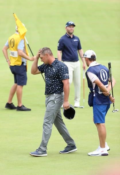 Bryson Dechambeau of The United States reacts on the 18th green during Day One of The 149th Open at Royal St George’s Golf Club on July 15, 2021 in...