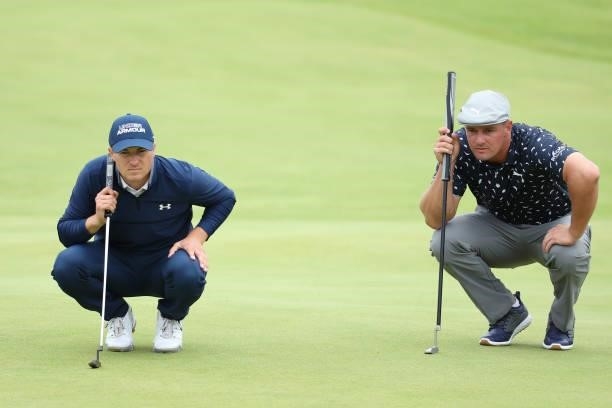 Jordan Speith and Bryson Dechambeau of The United States line up putts on the 18th green during Day One of The 149th Open at Royal St George’s Golf...
