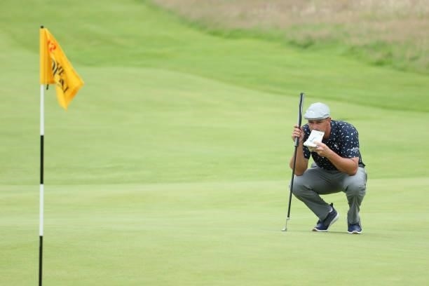 Bryson Dechambeau of The United States lines up a putt on the 18th green during Day One of The 149th Open at Royal St George’s Golf Club on July 15,...