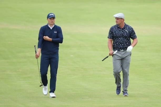 Jordan Speith and Bryson Dechambeau of The United States walk on the 18th hole during Day One of The 149th Open at Royal St George’s Golf Club on...