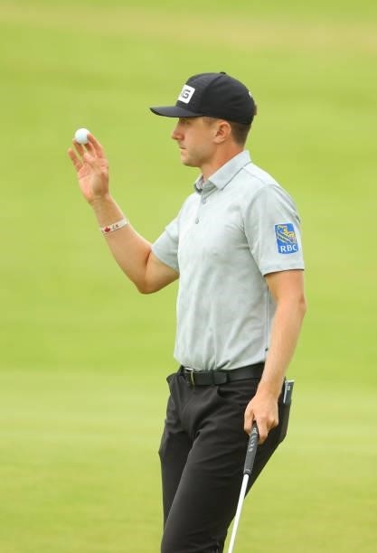 Mackenzie Hughes of Canada reacts on the 18th hole during Day One of The 149th Open at Royal St George’s Golf Club on July 15, 2021 in Sandwich,...