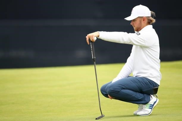 Amateur Joe Long of England lines up a putt on the 18th hole during Day One of The 149th Open at Royal St George’s Golf Club on July 15, 2021 in...