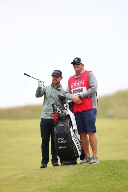 Brian Harman of the United States and his caddie speaks during Day One of The 149th Open at Royal St George’s Golf Club on July 15, 2021 in Sandwich,...