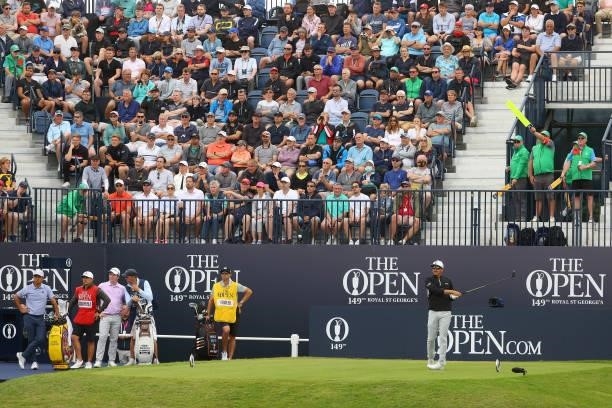 Rickie Fowler of the United States plays his shot from the first tee as fans watch on during Day One of The 149th Open at Royal St George’s Golf Club...