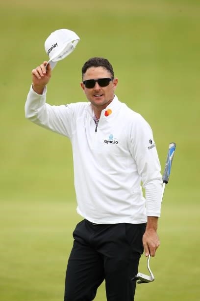 Justin Rose of England acknowledges the crowd on the 18th hole during Day One of The 149th Open at Royal St George’s Golf Club on July 15, 2021 in...