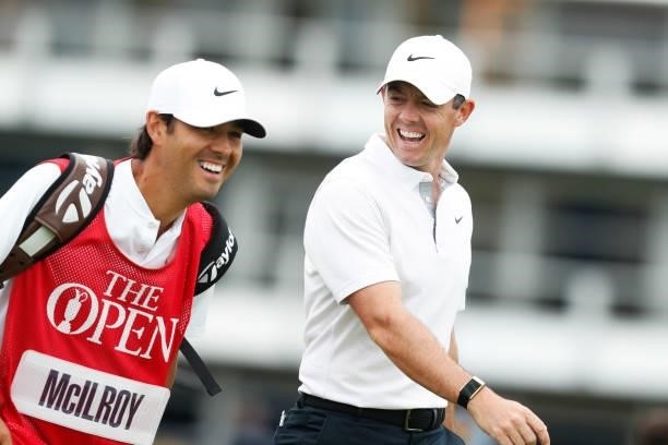 Rory McIlroy of Northern Ireland reacts towards his caddie during Day One of The 149th Open at Royal St George’s Golf Club on July 15, 2021 in...