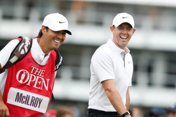 Rory McIlroy of Northern Ireland reacts towards his caddie during Day One of The 149th Open at Royal St George’s Golf Club on July 15, 2021 in...