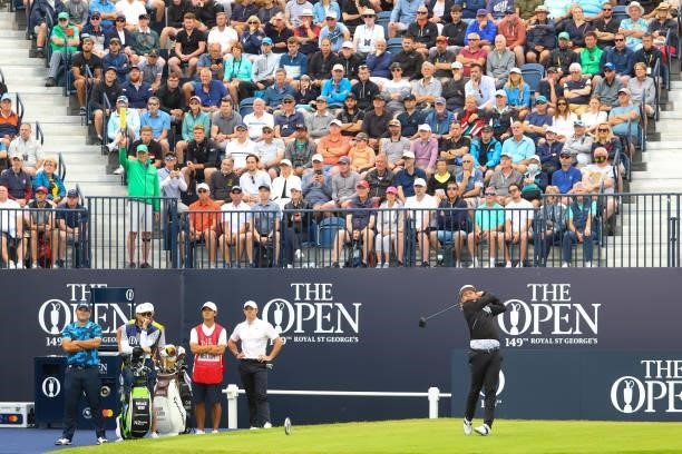 Cameron Smith of Australia plays his shot from the first tee as fans watch on during Day One of The 149th Open at Royal St George’s Golf Club on July...