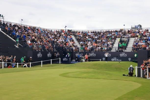 Rory McIlroy of Northern Ireland plays his shot from the first tee as fans watch on during Day One of The 149th Open at Royal St George’s Golf Club...
