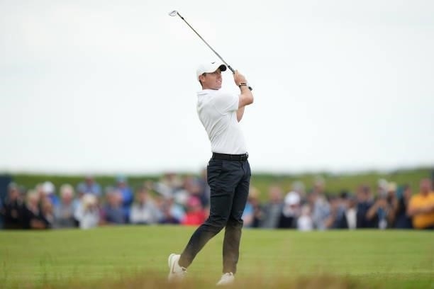 Rory McIlroy of Northern Ireland plays a shot on the first hole during Day One of The 149th Open at Royal St George’s Golf Club on July 15, 2021 in...