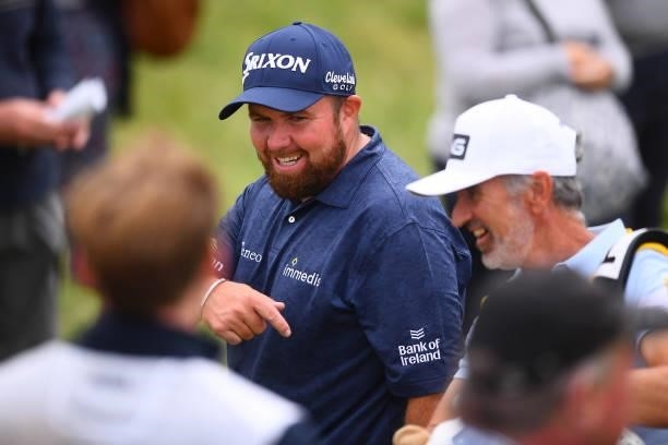 Shane Lowry of Ireland reacts as they walk towards the 17th tee during Day One of The 149th Open at Royal St George’s Golf Club on July 15, 2021 in...