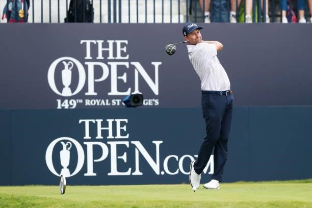 Webb Simpson of the United States plays his shot from the first tee during Day One of The 149th Open at Royal St George’s Golf Club on July 15, 2021...