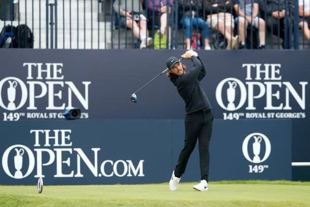Tommy Fleetwood of England plays his shot from the first tee during Day One of The 149th Open at Royal St George’s Golf Club on July 15, 2021 in...