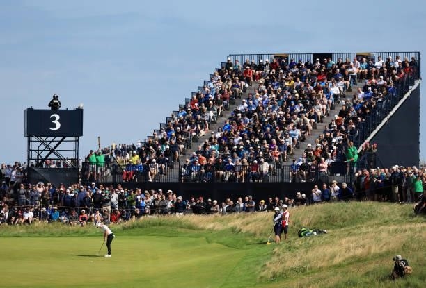 Rory McIlroy of Northern Ireland putts a shot on the third hole during Day One of The 149th Open at Royal St George’s Golf Club on July 15, 2021 in...