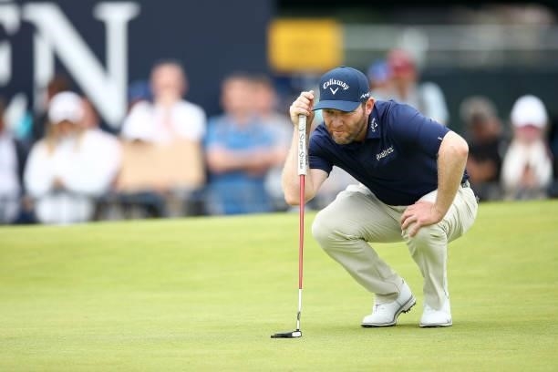 Branden Grace of South Africa lines up a putt on the 18th hole during Day One of The 149th Open at Royal St George’s Golf Club on July 15, 2021 in...
