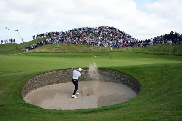 Rory McIlroy of Northern Ireland plays a bunker shot on the sixth hole during Day One of The 149th Open at Royal St George’s Golf Club on July 15,...