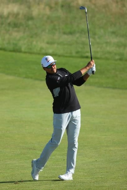 Rickie Fowler of the United States plays a second shot on the ninth hole during Day One of The 149th Open at Royal St George’s Golf Club on July 15,...