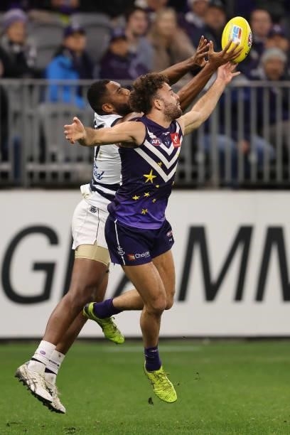 Esava Ratugolea of the Cats and Griffin Logue of the Dockers contest for the ball during the round 18 AFL match between the Fremantle Dockers and...