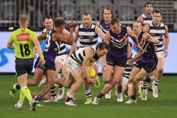 Tom Atkins of the Cats in action in action during the round 18 AFL match between the Fremantle Dockers and Geelong Cats at Optus Stadium on July 15,...