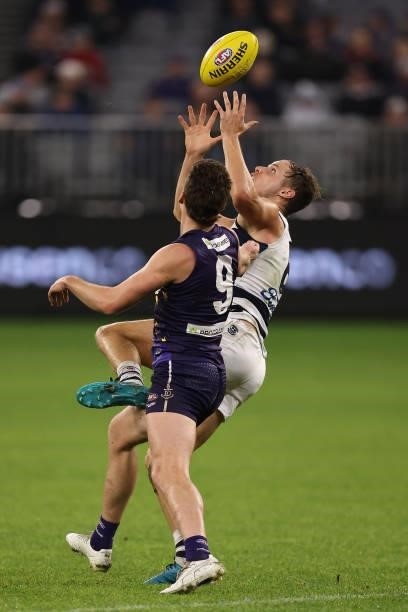 Jake Kolodjashnij of the Cats marks the ball against Blake Acres of the Dockers during the round 18 AFL match between the Fremantle Dockers and...