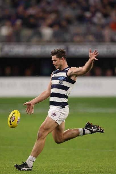 Tom Hawkins of the Cats kicks on goal during the round 18 AFL match between the Fremantle Dockers and Geelong Cats at Optus Stadium on July 15, 2021...