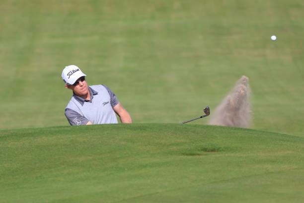 Brad Kennedy of Australia plays a third shot from a bunker on the 18th hole during Day One of The 149th Open at Royal St George’s Golf Club on July...