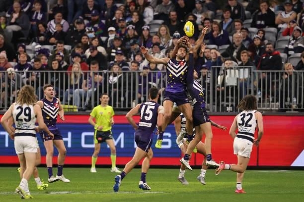 Griffin Logue of the Dockers contests for a mark during the round 18 AFL match between the Fremantle Dockers and Geelong Cats at Optus Stadium on...