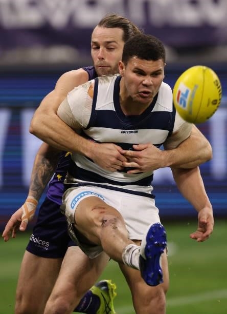 Travis Colyer of the Dockers tackles Brandan Parfitt of the Cats during the round 18 AFL match between the Fremantle Dockers and Geelong Cats at...