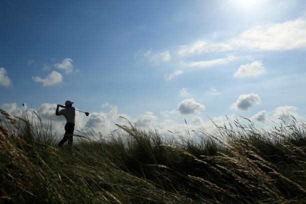 Rory McIlroy of Northern Ireland plays his shot from the ninth tee during Day One of The 149th Open at Royal St George’s Golf Club on July 15, 2021...