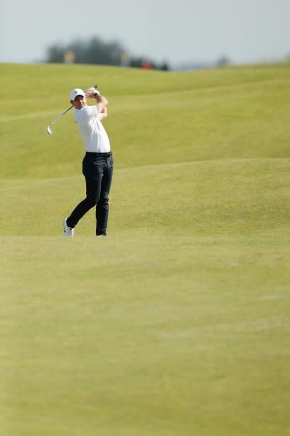 Rory McIlroy of Northern Ireland plays a shot on the seventh hole during Day One of The 149th Open at Royal St George’s Golf Club on July 15, 2021 in...