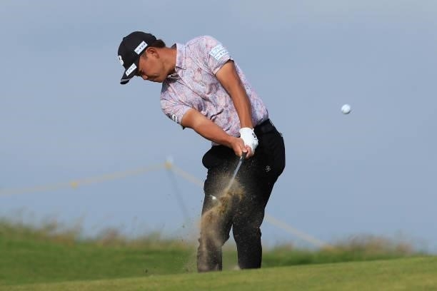 Ryosuke Kinoshita of Japan plays his second shot on the 8th hole during Day One of The 149th Open at Royal St George’s Golf Club on July 15, 2021 in...