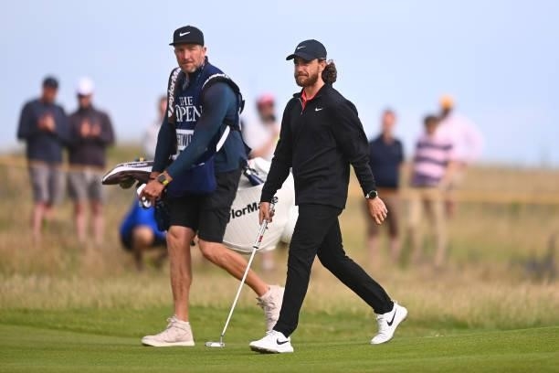 Tommy Fleetwood of England and caddie walk on the 11th hole during Day One of The 149th Open at Royal St George’s Golf Club on July 15, 2021 in...