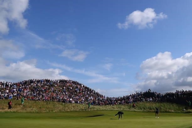 Tommy Fleetwood of England putts on the 6th green during Day One of The 149th Open at Royal St George’s Golf Club on July 15, 2021 in Sandwich,...